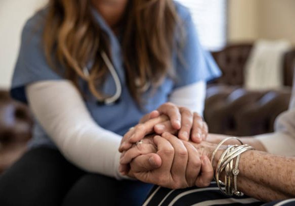A senior woman at home receiving healthcare.