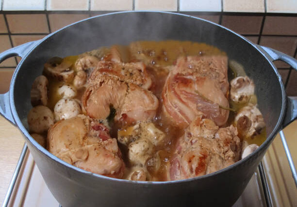 Veal paupiettes being cooked in a pot with button mushrooms  French cuisine