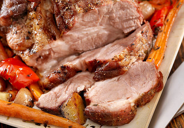 Pork Roast with Roasted Vegetables on a Platter -Photographed on Hasselblad H3D2-39mb Camera