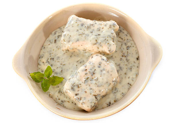salmon paupiette in front of white background