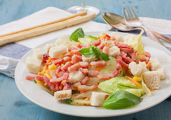 bacon salad decorated with basil leaves